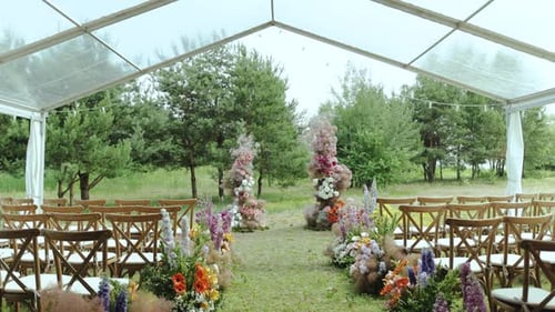Outside Wedding Ceremony in Park Among the Trees View of Beautiful and Tender Wedding Floral Arch