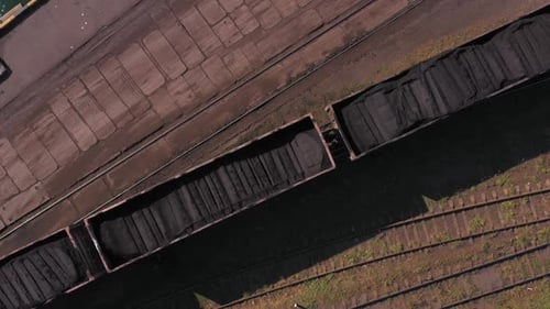Aerial View of Coal Train Traveling on Rails