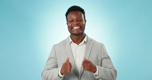 Black man, thumbs up in portrait with agreement and support, vote in studio and happy with feedback