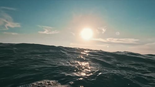 Slow Motion Footage of Ocean Wave at Sunrise Wide Footage