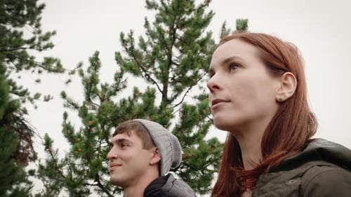 Couple Gazing Together in a Lush Green Forest