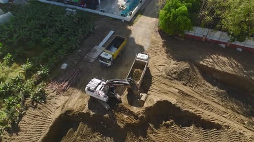 Excavation and Loading Aerial of Excavator at Work