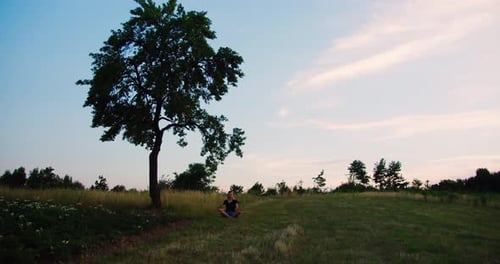 Concept of fitness, healthy lifestyle, Woman practises yoga at sunrise
