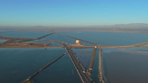 Aerial view of a road crossing cagliari salt flats in sardinia