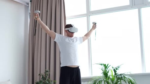 Young Adult Exercising with Virtual Reality Headset at Home