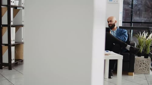 Men Collaborating on Project in Modern Office