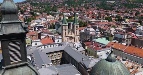 Aerial View Of Sacred Heart Cathedral In Sarajevo, Bosnia and Herzegovina With Serbian Orthodox