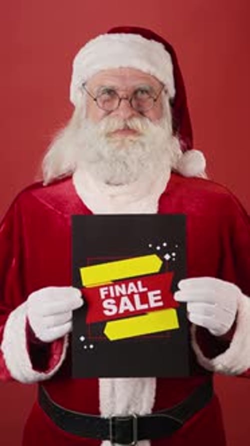 Jolly Santa Claus Holding Big Sale Poster