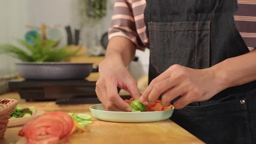 Close up of man cooking healthy food in kitchen in the morning at home.