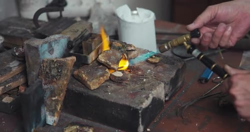 Jeweler Melts Silver with a Gas Burner in a Jewelry Workshop