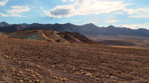 Aerial View of Arid Desert Landscape with Mountains