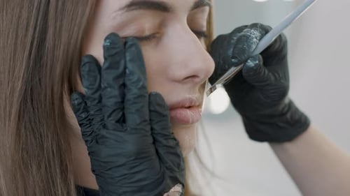 Woman Receives Lip Augmentation Cosmetic Treatment