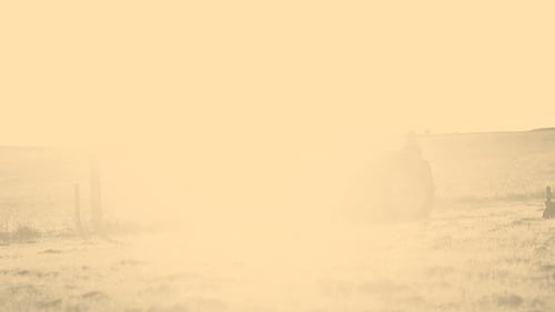 Farmer Driving Tractor in Field Agriculture