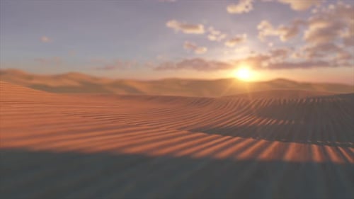 Warm Sunlight Illuminates Rippling Sand Dunes in a Vast Desert Landscape Creating a Serene and