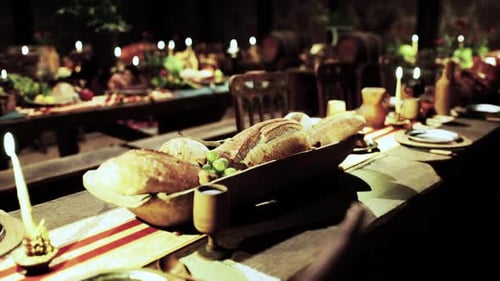 Rustic Banquet Table with Food and Warm Candlelight