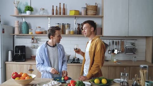 Young Adults Cooking Together in a Modern Kitchen