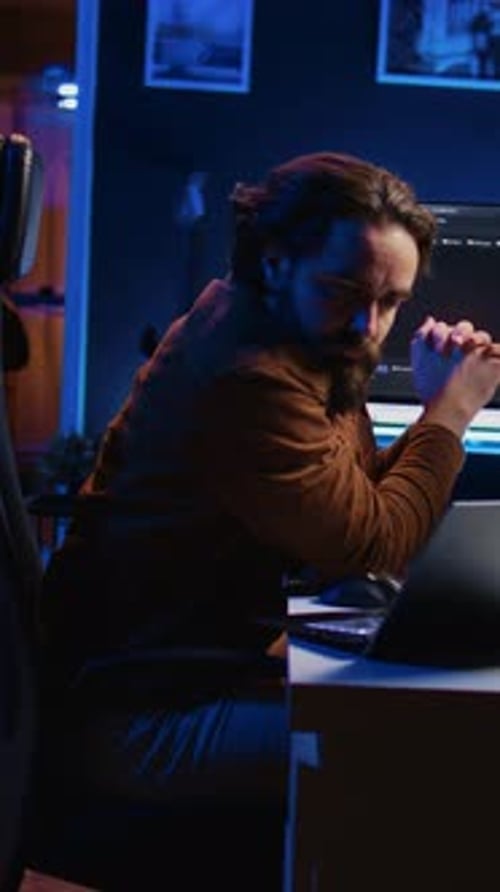 IT Professional Doing Multitasking in Apartment Office While Listening Music