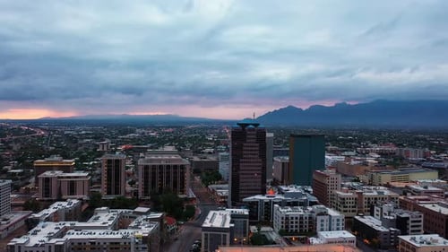View Of City Buildings In Downtown Tucson In Arizona During Blue Hour Twilight. aerial orbit