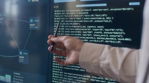 Anonymous Programmer Analyzing Coding Script on Computer in Office