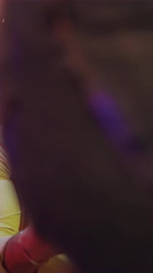 Young Adult Using Cell Phone at Party