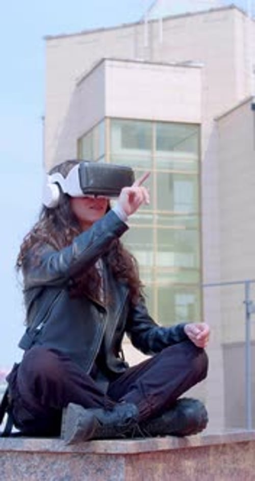 Young Woman Experiencing Virtual Reality Headset Outdoors