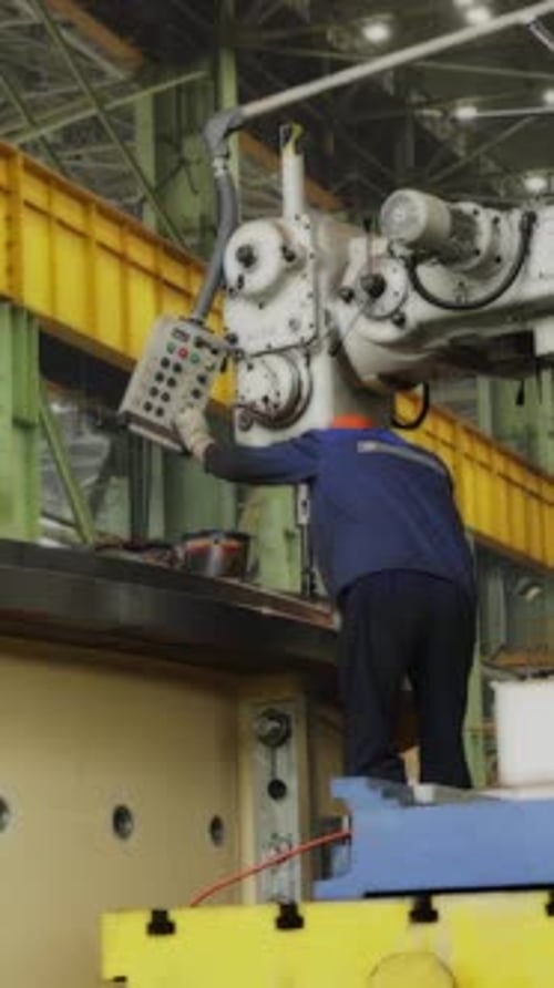 Factory Worker Operating Machinery for Metalworking Stock Clip