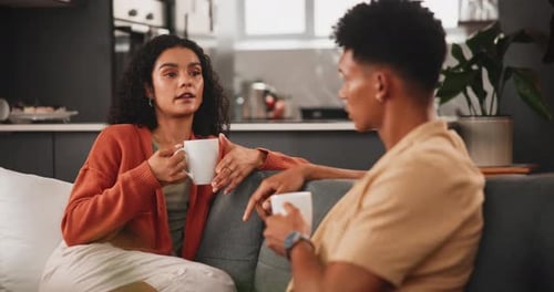 Couple Conversing at Home Over Coffee