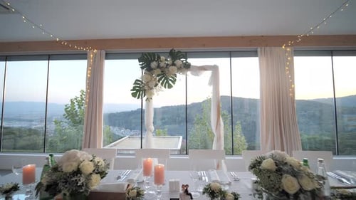 indoor wedding reception venue with dining tables and decoration, wide dolly