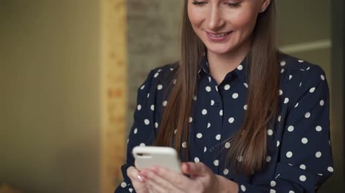 Woman Working in a Modern Office on a Computer Businesswoman Uses the Phone Social Networks Online