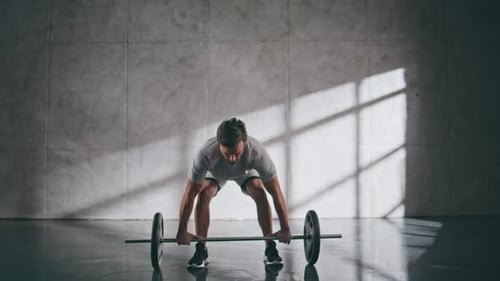 Muscular Sportsman Lifting Weights in Gym Sporty Powerlifter Fitness Workout
