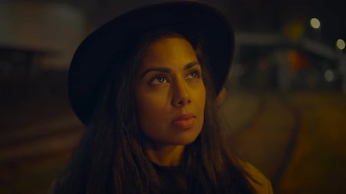 Stylish Woman Taking Photos in the City at Night