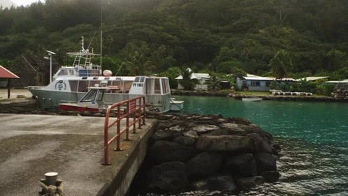 Port in the Rikitea on the gambier Island. Ship wait for travel.