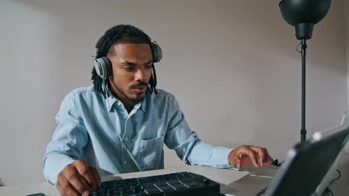 Adult Making Music with Technology Indoors