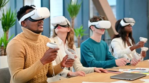 Business conference in VR in an office. Multiracial group of people using VR glasses and controllers