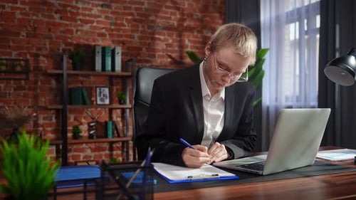 Focused Professional Writing Notes in Modern Office