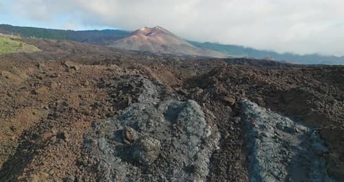 Land covered by solidified lava flows coming from new volcano, aerial