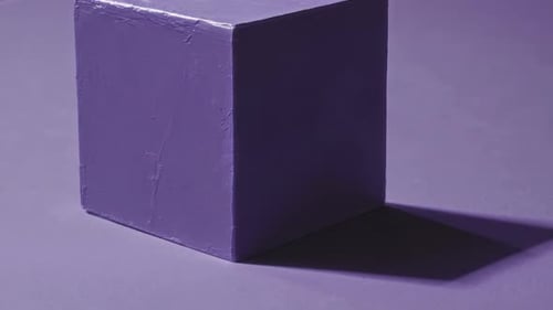 Minimalist Purple Cube with Dynamic Light and Shadow Effect