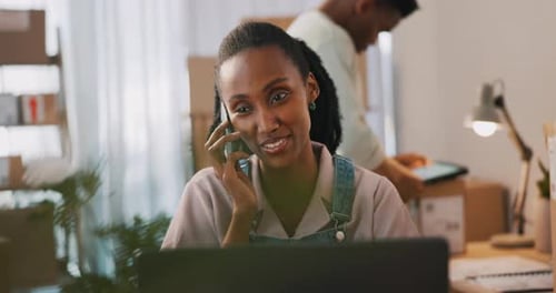 Woman Smiling on Phone in Home Office