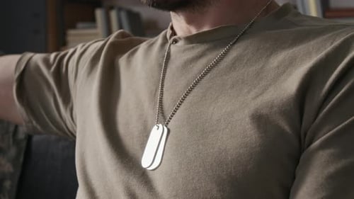 Torso of Military Man Wearing Dog Tags