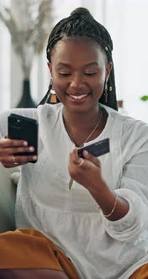 Young Woman Shopping Online With Mobile Device