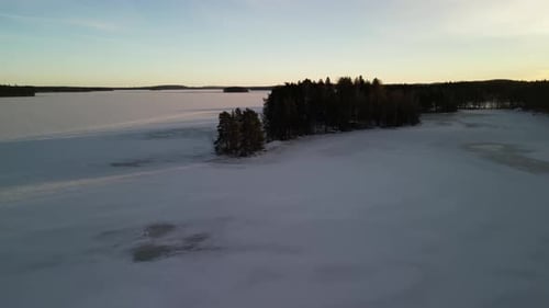 Aerial view of winter landscapes with snow-covered forest in Finland