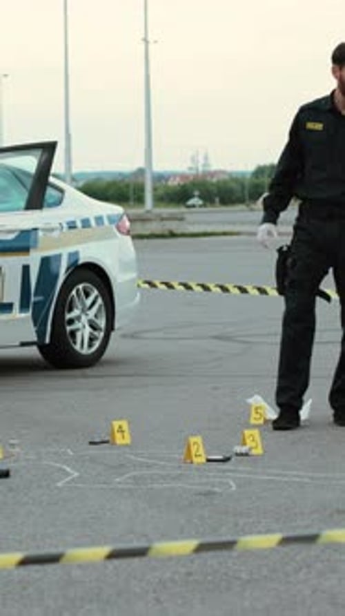 Detectives Investigating Crime Scene Outdoors