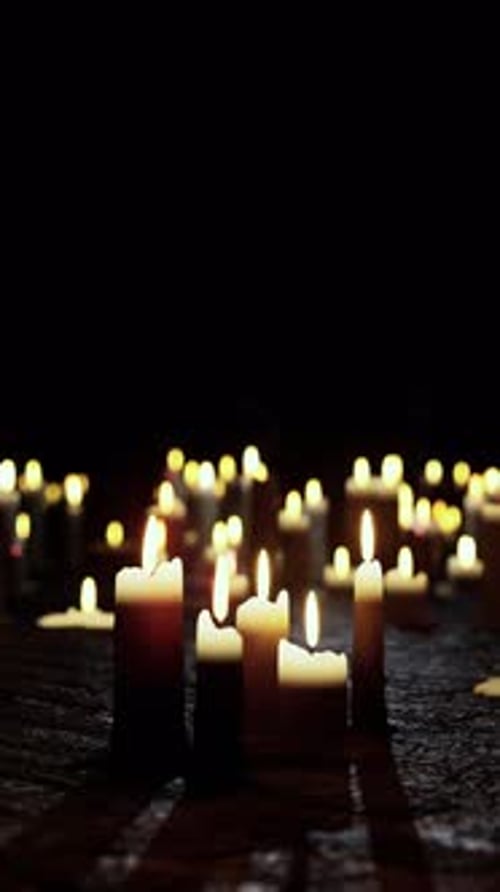 Many Lit Candles on Table