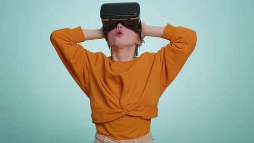 Blonde Woman Using Virtual Reality Futuristic Technology Headset to Play Simulation 3D Video Game