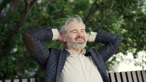 Man Relaxing on a Park Bench