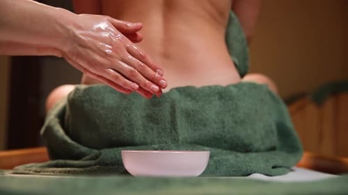 Ayurvedic massage for beautiful woman in spa