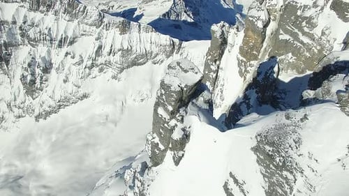 Snowy Peaks in Majestic Mountain Range Surrounded By Wilderness and Untouched Beauty