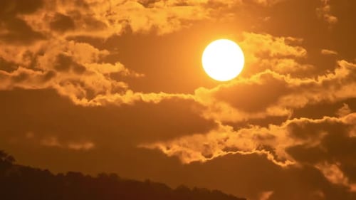 Dramatic Sunrise With Golden Clouds And Rising Sun
