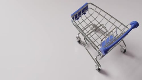 High angle view of empty shopping trolley on white background with copy space