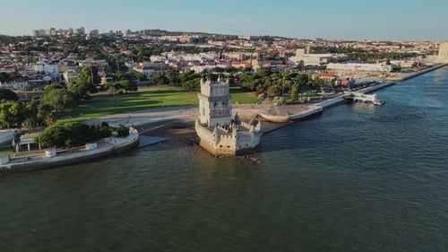 Aerial Drone View of Belem Tower on the Bank of the Tagus River at Sunset Lisbon Portugal